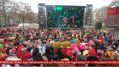 Karneval geht weiter, der Krieg bleibt dank Nachrichtenband immer dabei