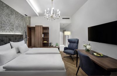 Mit viel Liebe zum Detail eingerichtet, verspricht das Design Zimmer im Hotel Schwarzer Adler Innsbruck höchsten Komfort für Gäste